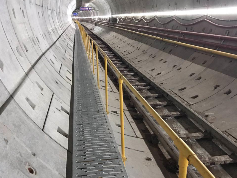 Underground TBM tunnels with walkway, rails, brackets, sleepers