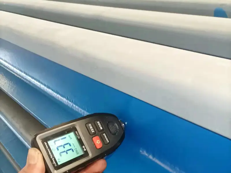 Steel rails with anti-corrosion coating applied to web for long-term protection.