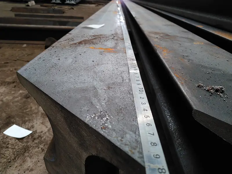 Rails end miter cut at precise angle for custom joint installation.