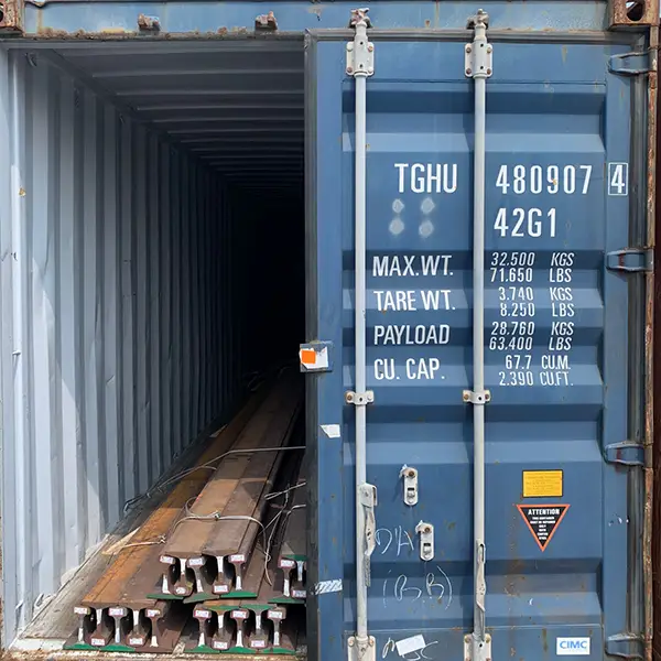 Steel rails packed in a shipping container