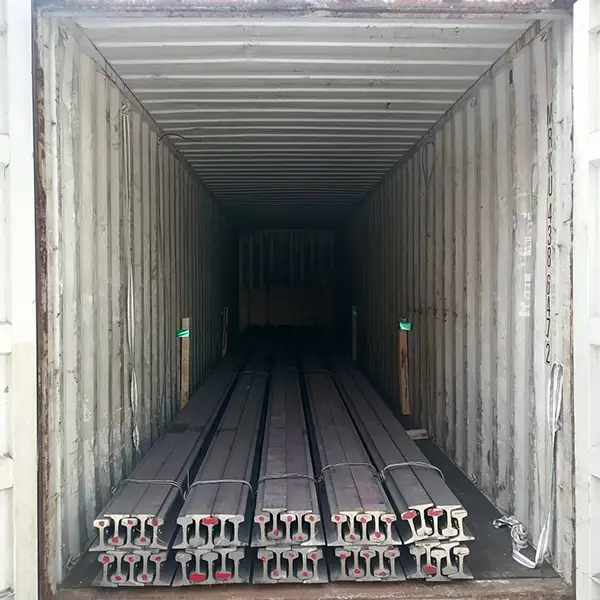 Rails secured in container for shipping
