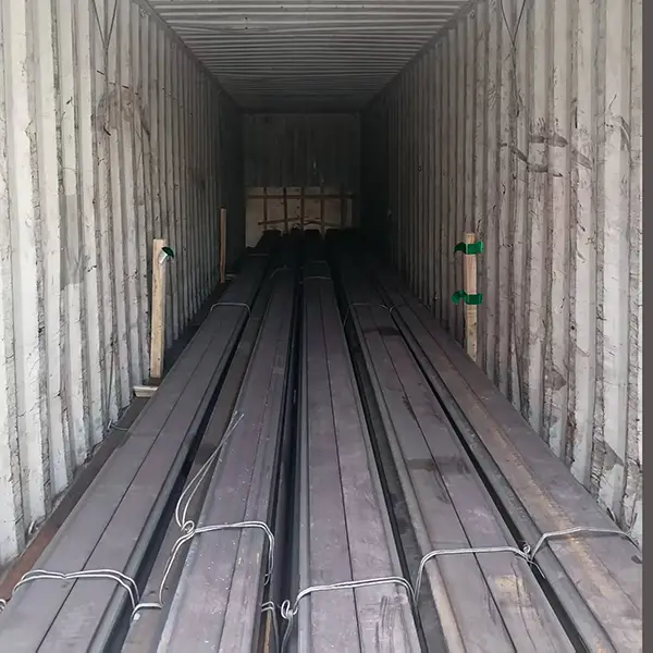 54E5 rail bundles secured in container