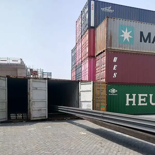 Forklift loading railroad track into container
