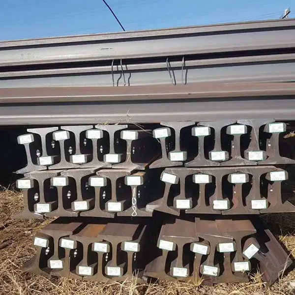 50e5 rails stacked outdoors in yard