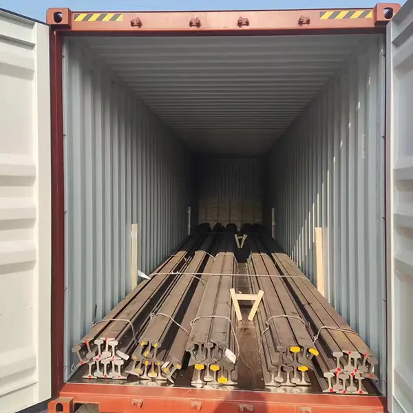 Railroad rail secured in container