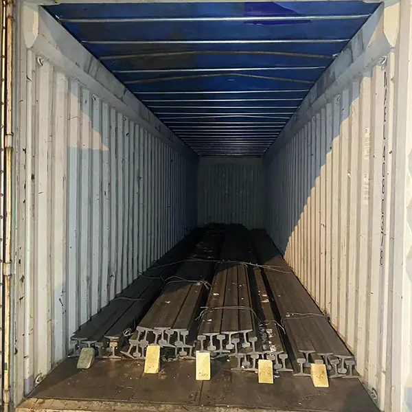 Railway rail packed into shipping container