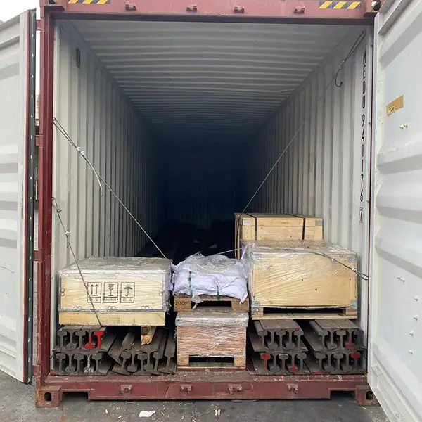 Railway rails secured in container