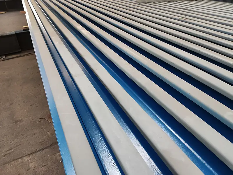 60E2 rail with protective coating finish