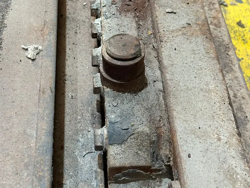 Severely oxidized high temperature rail removed from furnace after long-term exposure over 600°C.