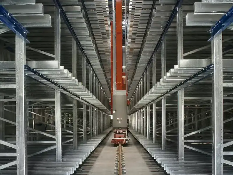 Automated stacker crane running on steel rail system in warehouse