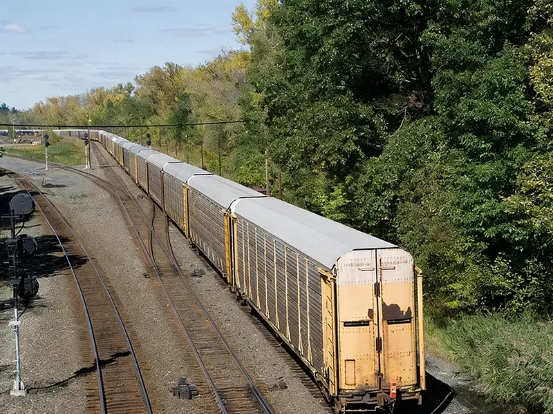 Freight train on AREMA-compliant steel rail standards in suburban Philadelphia, USA