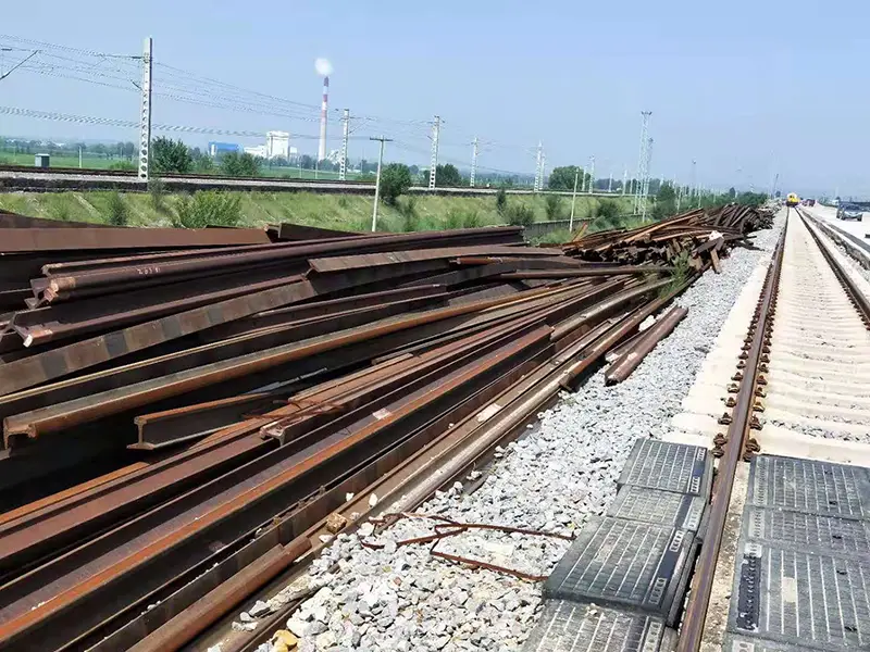 Old railway rails stored for railway rail recycling