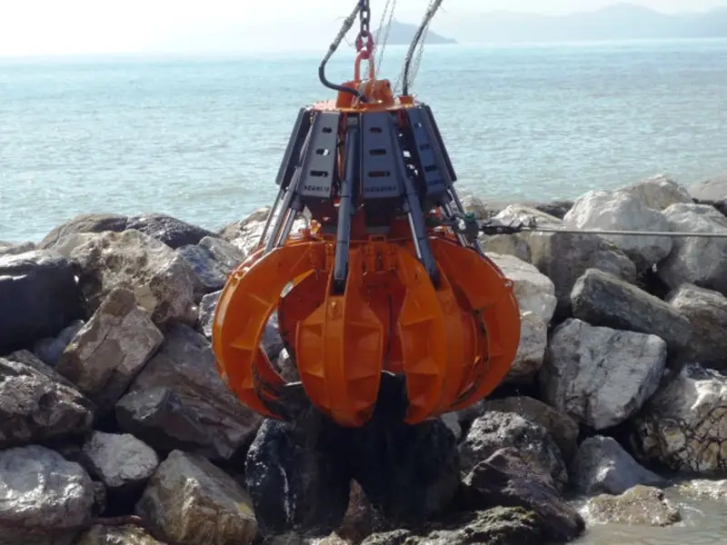 Hydraulic Orange Multi-Jaw Grapple Handling Rocks