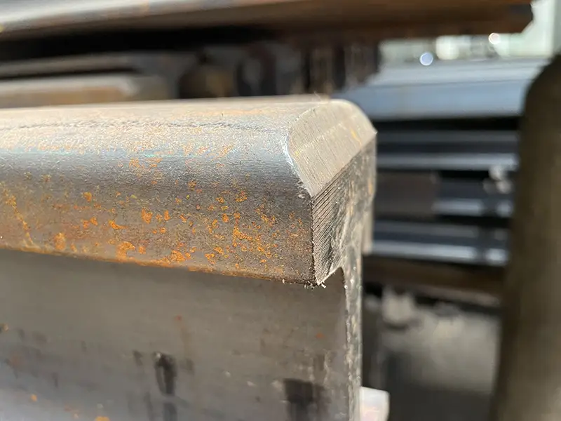 rail head beveling on crane rail head