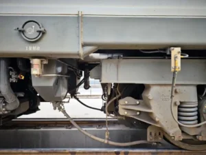 Close-up of train wheel on rail showing contact area related to train sanding system and traction performance