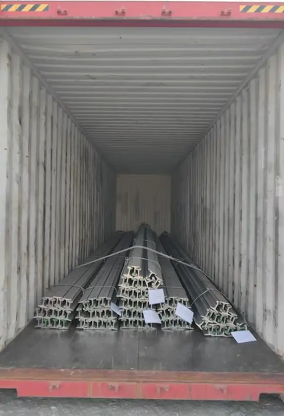 Steel rails bundled and labeled for container shipping