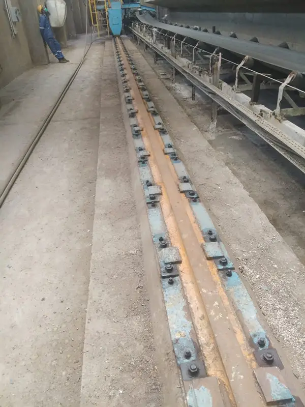 Old fertilizer conveyor rails before replacement