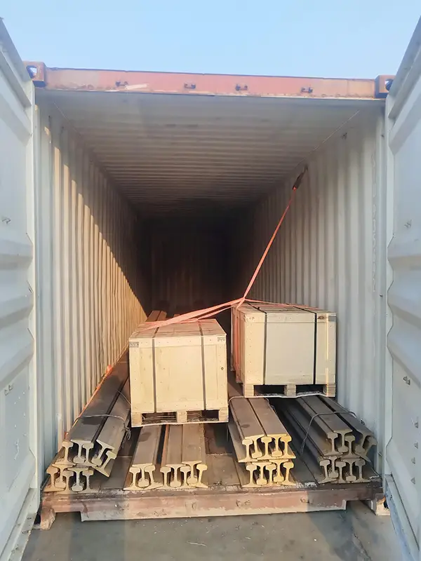 QU80 and QU100 rails loaded in containers for a crane rail project in Saudi Arabia