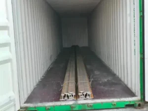 Steel rails loaded for shipment to Philippines industrial rail project