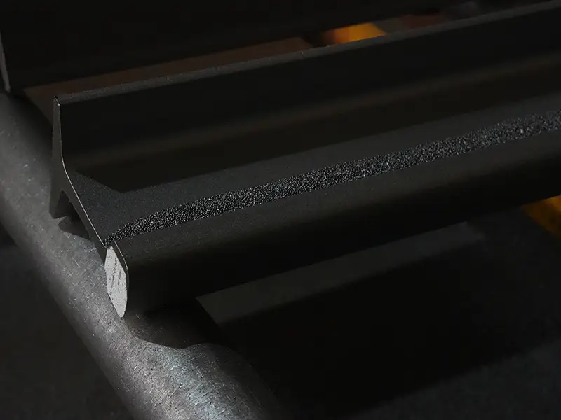 Abrasive blasting detail across the rail profile