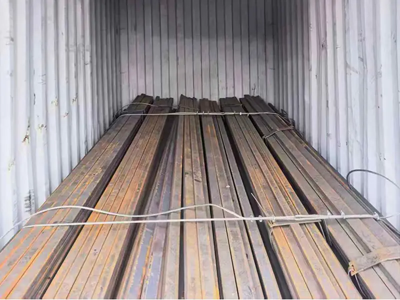 Steel flat bars secured inside container before shipment