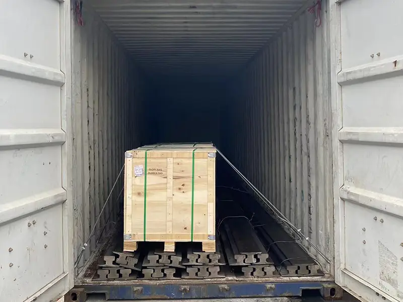 A100 crane rails with rubber pads loaded and secured in a shipping container for Jakarta shipment