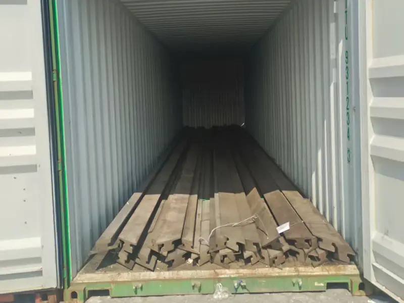 A100 crane rails secured in a shipping container before shipment to India