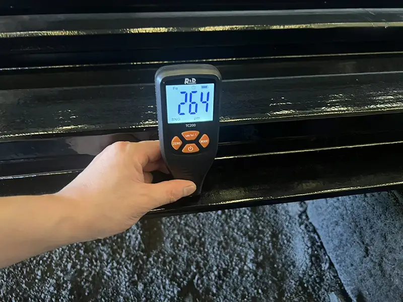 Jotun Hardtop XP coating thickness check on A100 rail