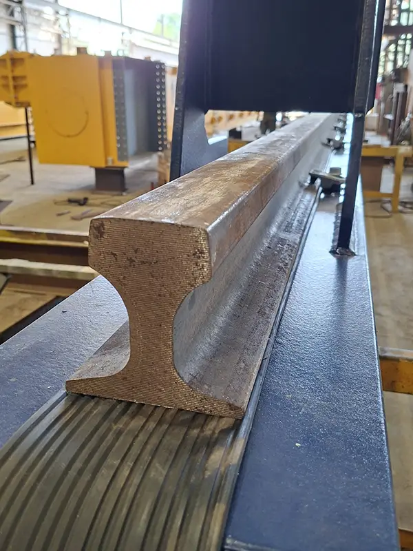 QU70 rail installed on rubber pad at project site
