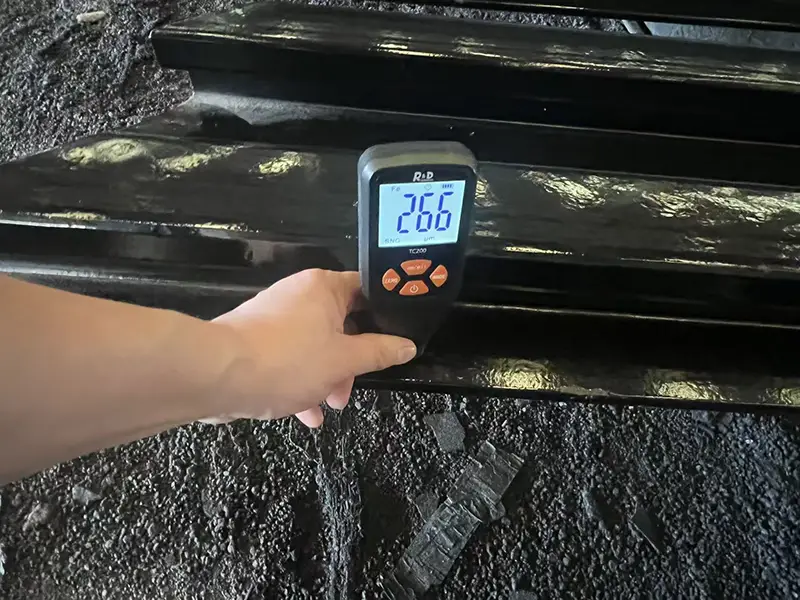 RAL 9005 topcoat thickness measurement on A100 rail